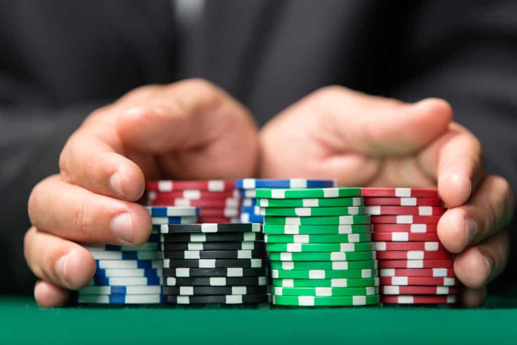 Player pushing all his chips in, going all in