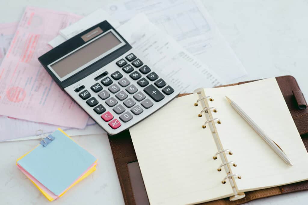 Planning a budget with paper and a calculator