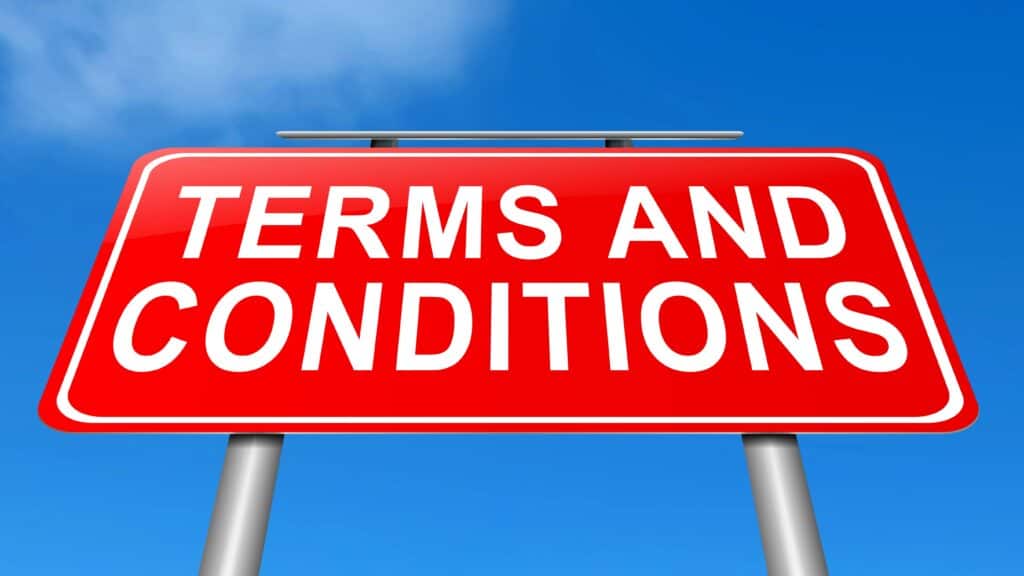 Terms and conditions on a road sign with a sky background